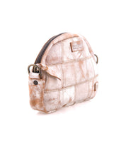 Introducing Abundance by Bed|Stü: a small, dome-shaped crossbody bag made from reclaimed leather featuring a unique patchwork pattern, zipper closure, side pocket, and metal hardware. Shown here in a distressed beige and white finish against a white background, this sustainable accessory makes an eco-friendly style statement.