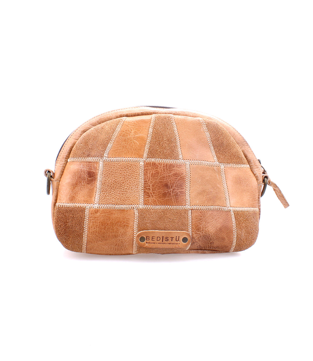 Introducing Abundance, a patchwork tan leather cosmetic bag with a zipper, crafted from sustainable reclaimed leather and featuring the Bed|Stü logo plaque on the front, shown against a white background.