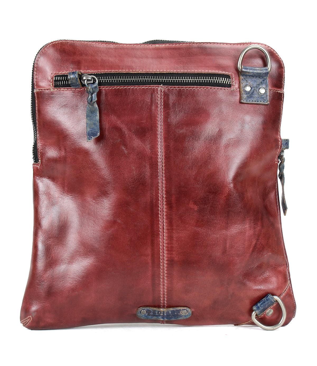 Introducing the Aiken by Bed|Stü—a square-shaped, brown full-grain leather bag featuring a front zipper pocket, visible stitching, and distinctive metal rings positioned on the top right and bottom left corners. This stylish accessory comes with an adjustable strap for comfortable carrying.