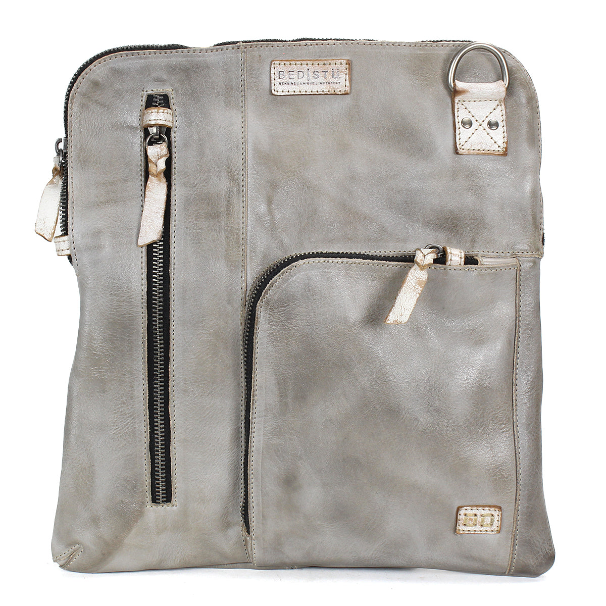 Introducing the Aiken by Bed|Stü—a square crossbody crafted from light gray full-grain leather, featuring two zippered pockets on the front, a small patch label, and a silver D-ring near the top right corner. The adjustable strap ensures comfortable and versatile wear.