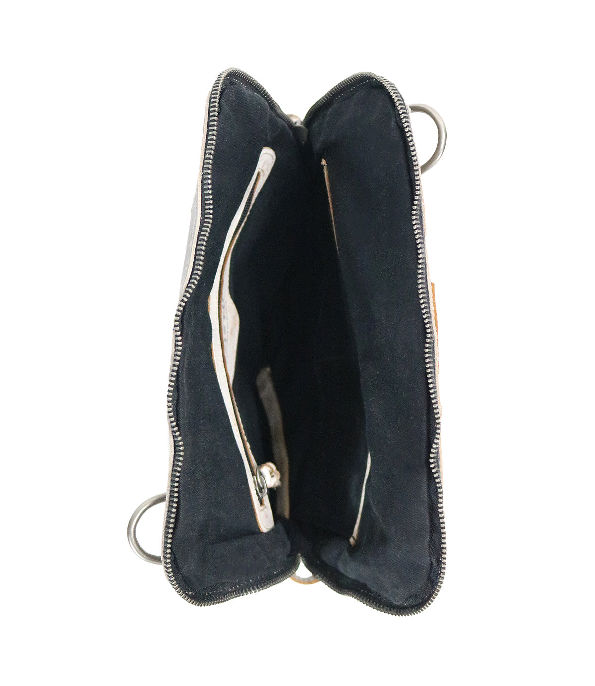 The Bed|Stü Aiken bag, crafted from full-grain black leather, features a zippered top, two spacious compartments, and a small inner pocket—displayed from above against a white background.