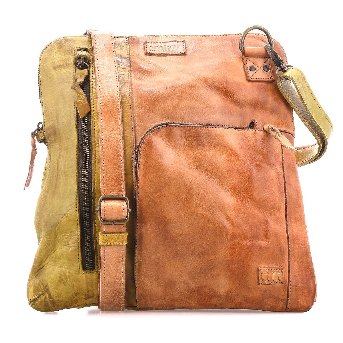 The Bed|Stü Aiken is a square, two-tone full-grain leather bag featuring a front pocket, adjustable strap, and zipper accents for style and durability. Designed with anti-theft security elements for your peace of mind, the Aiken is shown against a white background.