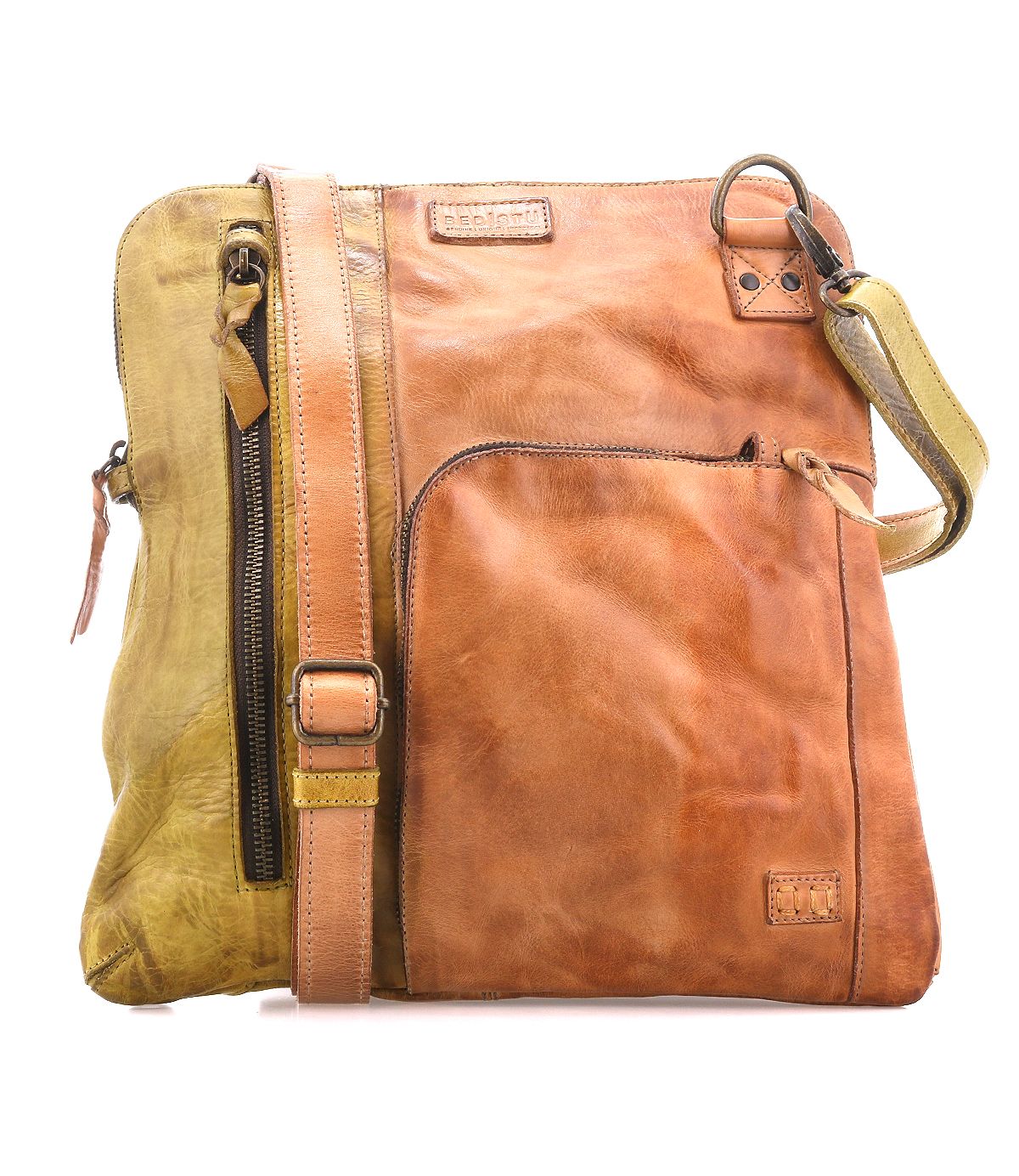 The Bed|Stü Aiken is a square, two-tone full-grain leather bag featuring a front pocket, adjustable strap, and zipper accents for style and durability. Designed with anti-theft security elements for your peace of mind, the Aiken is shown against a white background.