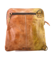 Introducing the Aiken by Bed|Stü—a square crossbody bag crafted from full-grain leather in a beautiful brown to yellow gradient. This stylish bag features a front zipper pocket, distinctive ring detail, an adjustable strap for customizable comfort, and an anti-theft security design for extra peace of mind.