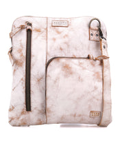 The Aiken crossbody bag by Bed|Stü features light brown full-grain leather, two front zippered pockets, an adjustable and detachable strap, visible stitching details, and built-in anti-theft security features.