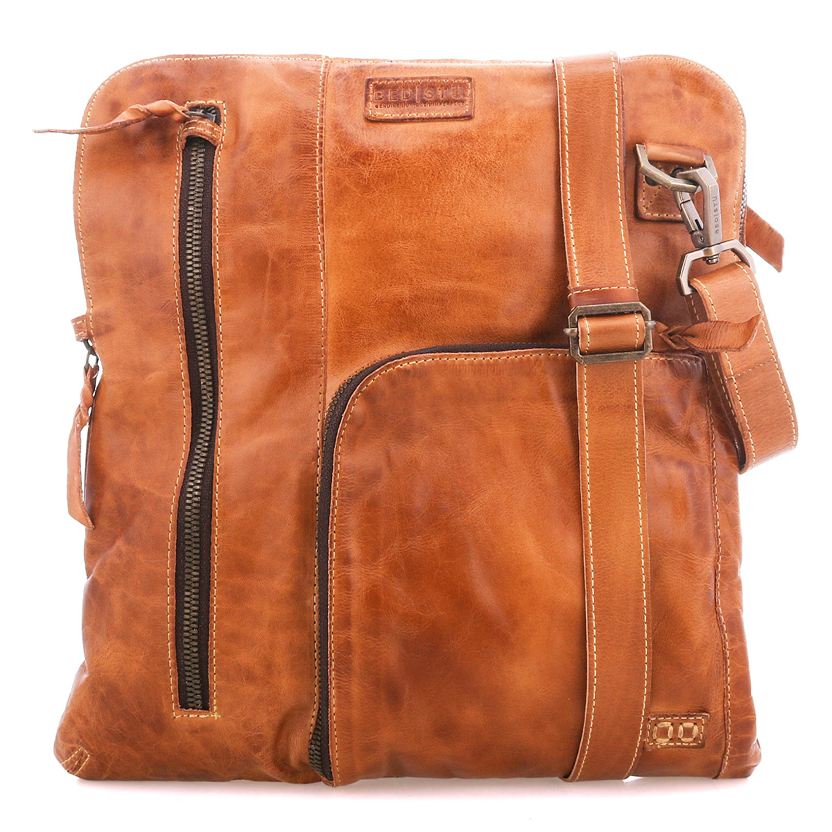The Bed|Stü Aiken crossbody bag is crafted from full-grain leather and features an adjustable strap, front zipper pockets for easy access, and a stitched logo patch near the top. For added peace of mind while you're on the go, it also includes anti-theft security features.