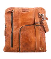 The Bed|Stü Aiken crossbody bag is crafted from full-grain leather and features an adjustable strap, front zipper pockets for easy access, and a stitched logo patch near the top. For added peace of mind while you're on the go, it also includes anti-theft security features.