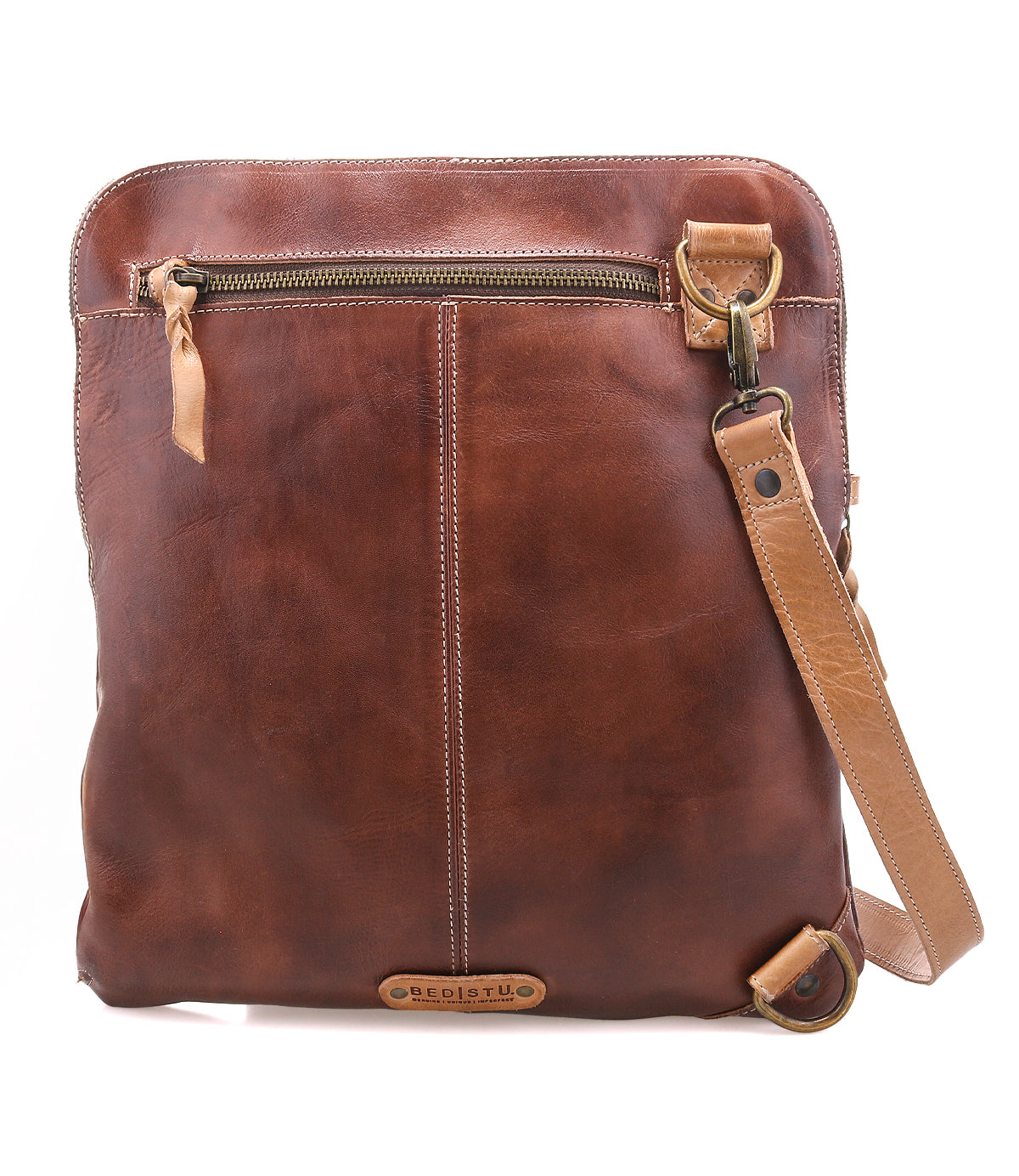The Aiken crossbody bag by Bed|Stü is crafted from brown full-grain leather and showcases a front zipper pocket, adjustable strap, and visible stitching detail. Designed with anti-theft security features, this bag keeps your essentials safe wherever you go.