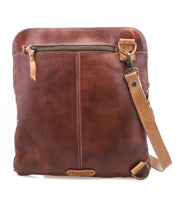 The Aiken crossbody bag by Bed|Stü is crafted from brown full-grain leather and showcases a front zipper pocket, adjustable strap, and visible stitching detail. Designed with anti-theft security features, this bag keeps your essentials safe wherever you go.