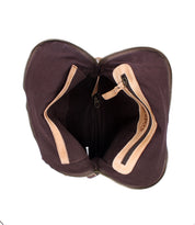 Top view of the Bed|Stü Aiken bag, showcasing its open brown canvas and full-grain leather construction with a spacious interior, visible zipper pocket, and tan leather trim. Designed with an adjustable strap for comfortable carrying and equipped with anti-theft security features for added peace of mind.