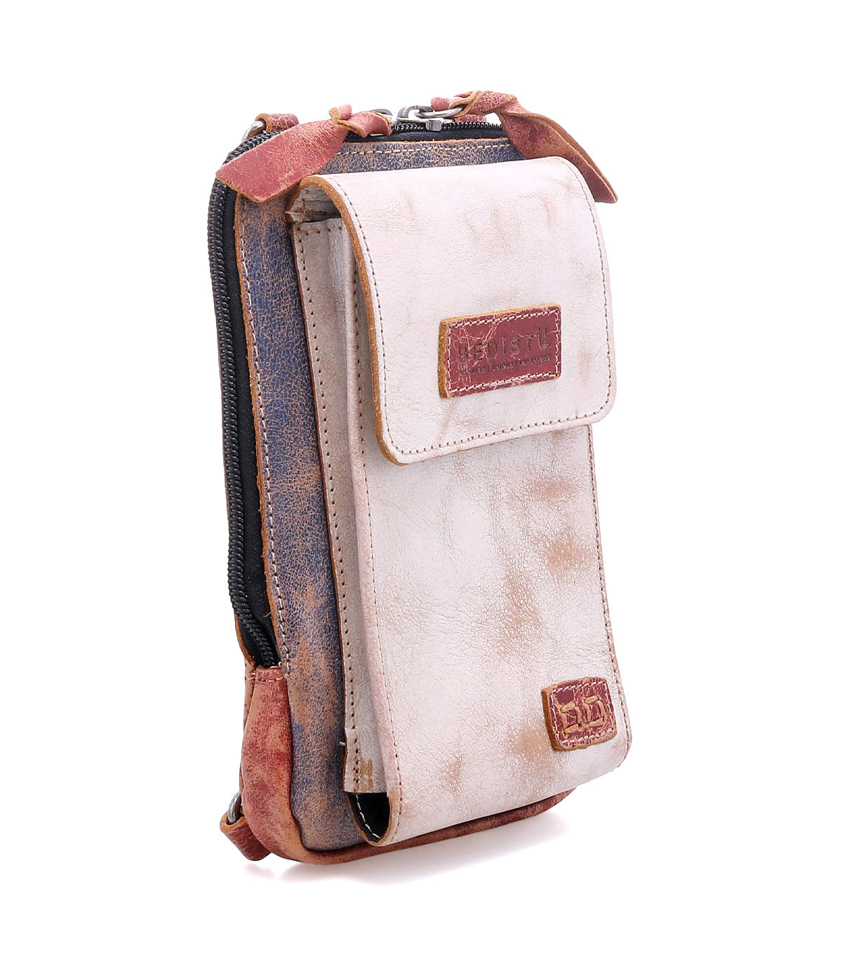 The Bed|Stü Alelike is a small, rectangular crossbody pouch crafted from light brown leather, featuring a front flap, zipper compartment, and dark brown stitching—ideal for keeping your travel essentials organized in style.