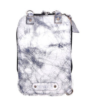 Introducing the Bed|Stü Alelike: a compact white and gray marbled leather crossbody bag featuring a zipper closure, metal accents, and a prominent Bed|Stü brand label plate on the front—perfect for carrying your travel essentials in style.