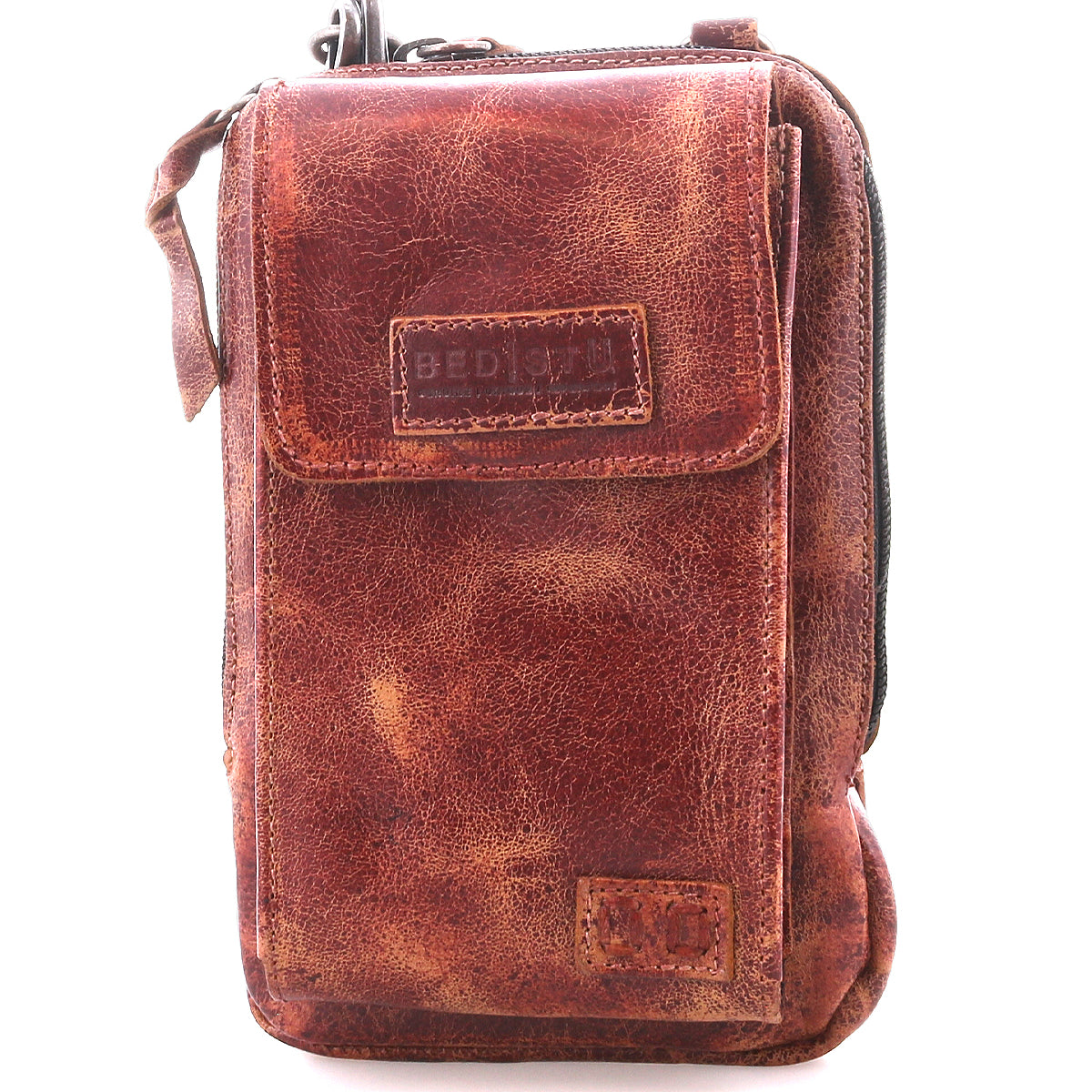 The Bed|Stü Alelike is a brown distressed leather crossbody bag featuring a front flap, right-side zipper, and visible stitching—ideal for carrying travel essentials. This compact purse is photographed against a white background.