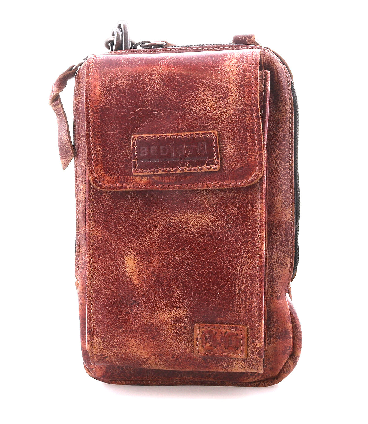 The Bed|Stü Alelike is a brown distressed leather crossbody bag featuring a front flap, right-side zipper, and visible stitching—ideal for carrying travel essentials. This compact purse is photographed against a white background.