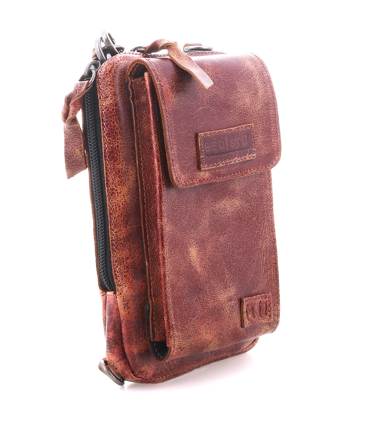 The Alelike by Bed|Stü is a small brown leather crossbody bag featuring a textured finish, front flap pocket, and secure zipper closure—ideal for organizing your travel essentials—shown here against a white background.
