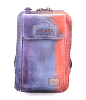 Compact and stylish, the Alelike leather crossbody bag by Bed|Stü showcases a stunning gradient design in purple, blue, and red tones—perfect for carrying your travel essentials on the go. The front flap features the "Bed|Stü" logo, while visible stitching along the edges adds a touch of handcrafted charm.
