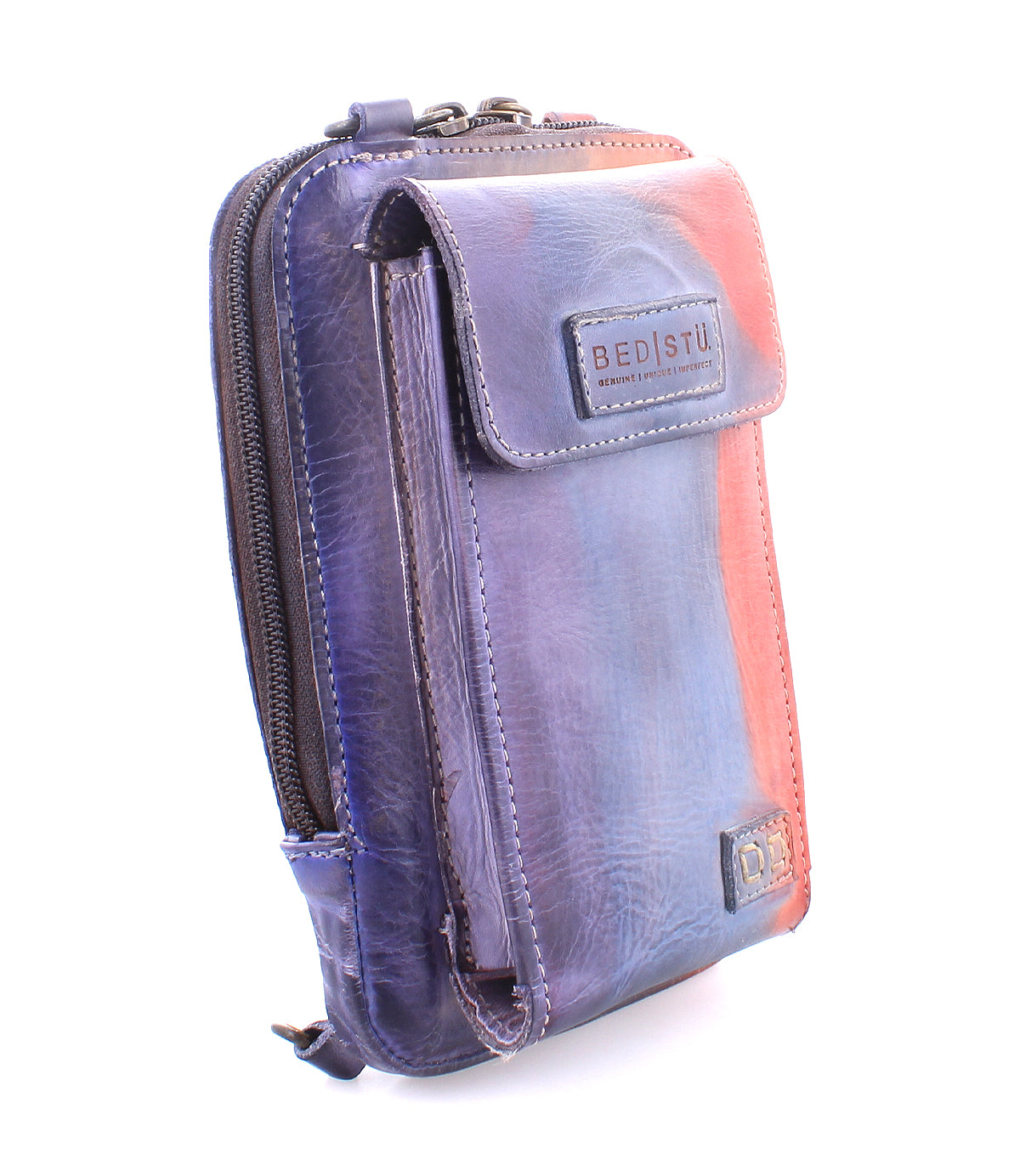 Introducing the Bed|Stü Alelike—a compact and versatile leather crossbody purse featuring a flap pocket, zipper compartment, and the iconic Bed|Stü logo, all crafted in stunning purple and reddish tones. It’s perfect for carrying your travel essentials in style.