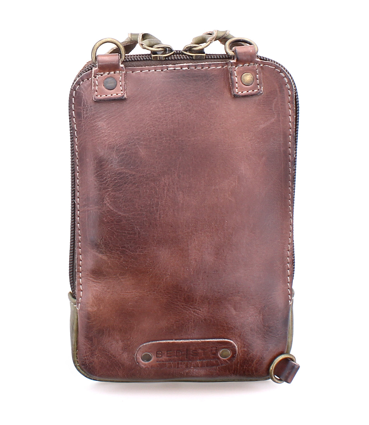 The Alelike by Bed|Stü is a brown leather crossbody shoulder bag featuring a zipper closure, metal hardware, and visible stitching. Compact and perfect for carrying your travel essentials, this purse is photographed against a white background.