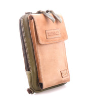 A tan and olive green leather crossbody pouch from Bed|Stü, the "Alelike," features a front flap with the Bed|Stü logo and a zipper compartment—perfect for carrying your travel essentials in a compact purse.