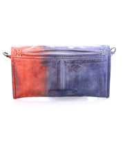 Introducing Amina by Bed|Stü—a stylish leather clutch bag with a front zipper pocket and a striking gradient color fade from red on the left to blue on the right. This versatile accessory also doubles as a compact wallet for your essentials.