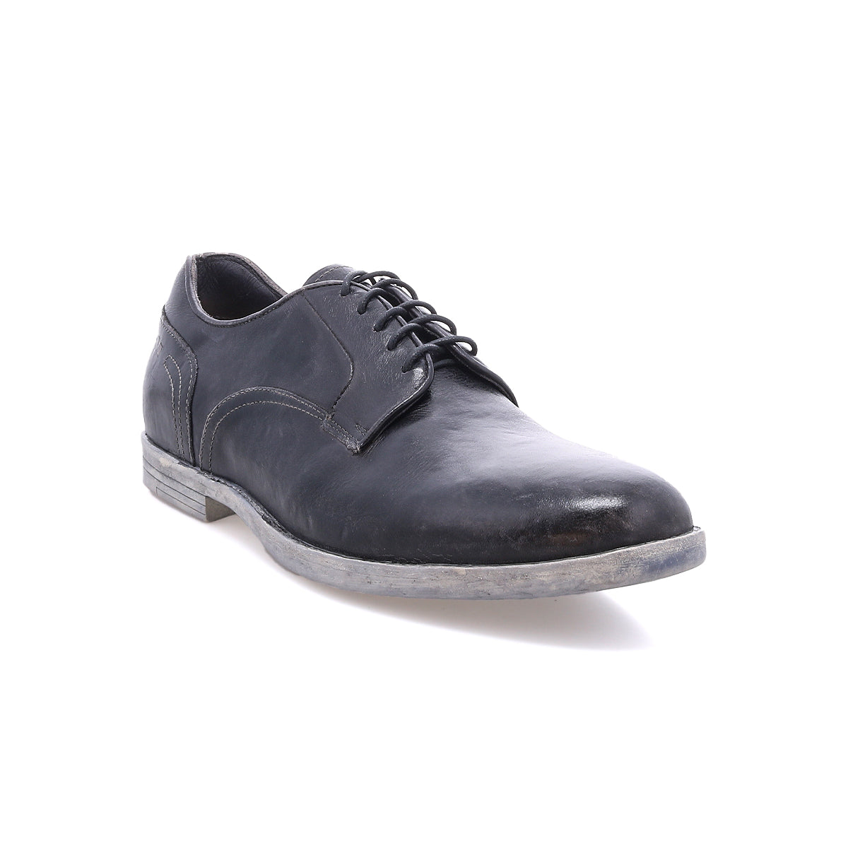 The Bed|Stü Anchiano is a black leather lace-up oxford shoe featuring distressed leather and a slightly worn grey, flexible sole, photographed against a white background.