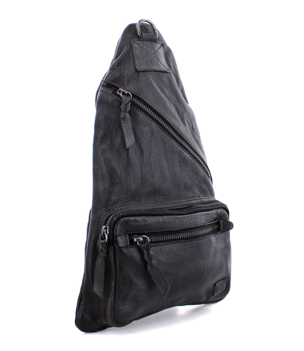 Bed|Stü Andie black leather sling bag with three zippered compartments and an adjustable strap, displayed upright on a white background.