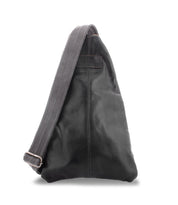 The Andie by Bed|Stü is a sleek black leather sling bag featuring a wide, adjustable gray fabric strap, shown against a plain white background.