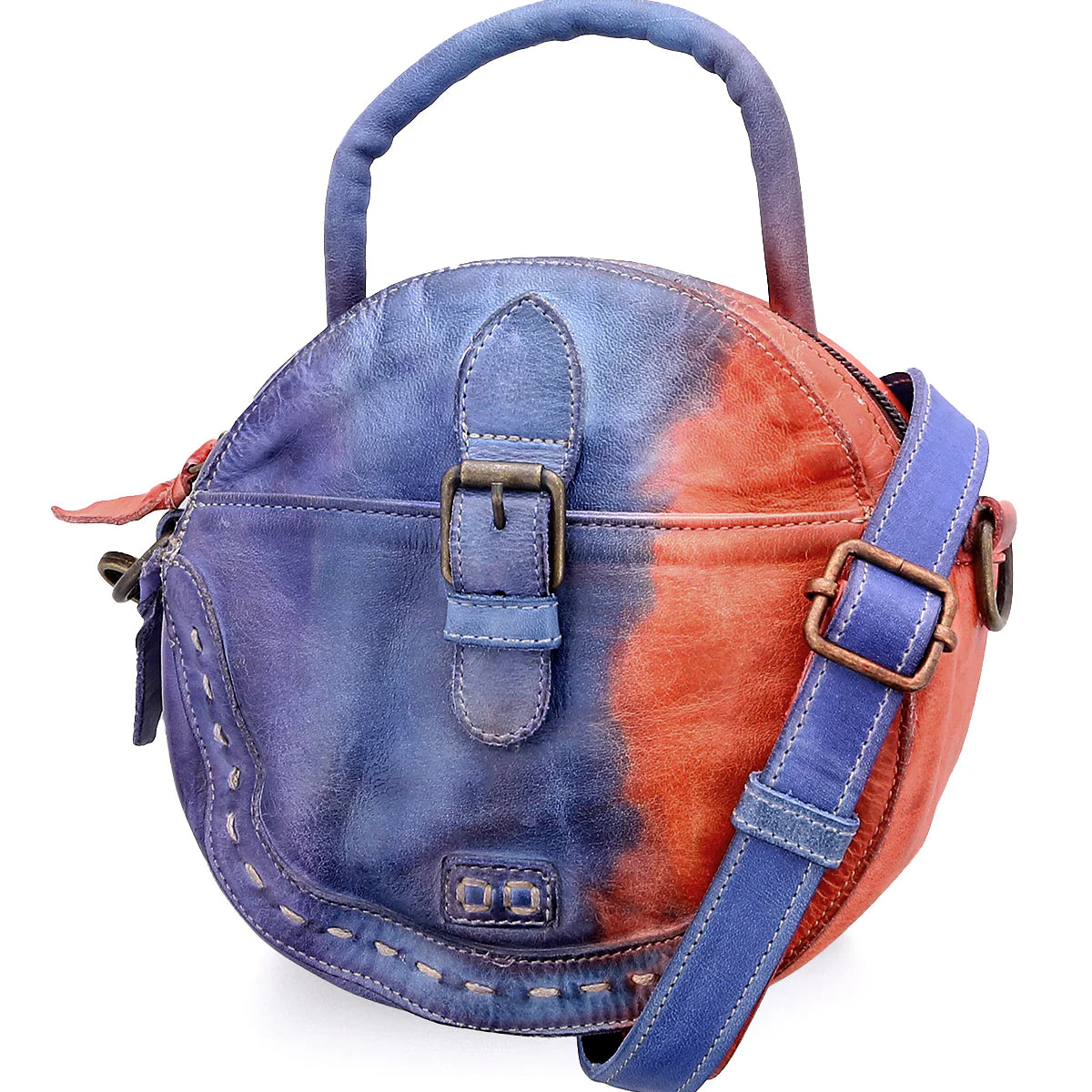 The Arenfield by Bed|Stü is a round leather crossbody bag featuring a top handle, front buckle detail, and an adjustable shoulder strap, designed with a striking blue and red gradient color pattern and secured with a zip-top closure.