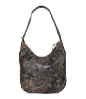 The Argus shoulder bag by Bed|Stü features distressed brown handcrafted leather with a wide strap, visible seams, oversized front pockets, and a rustic, worn-in look.