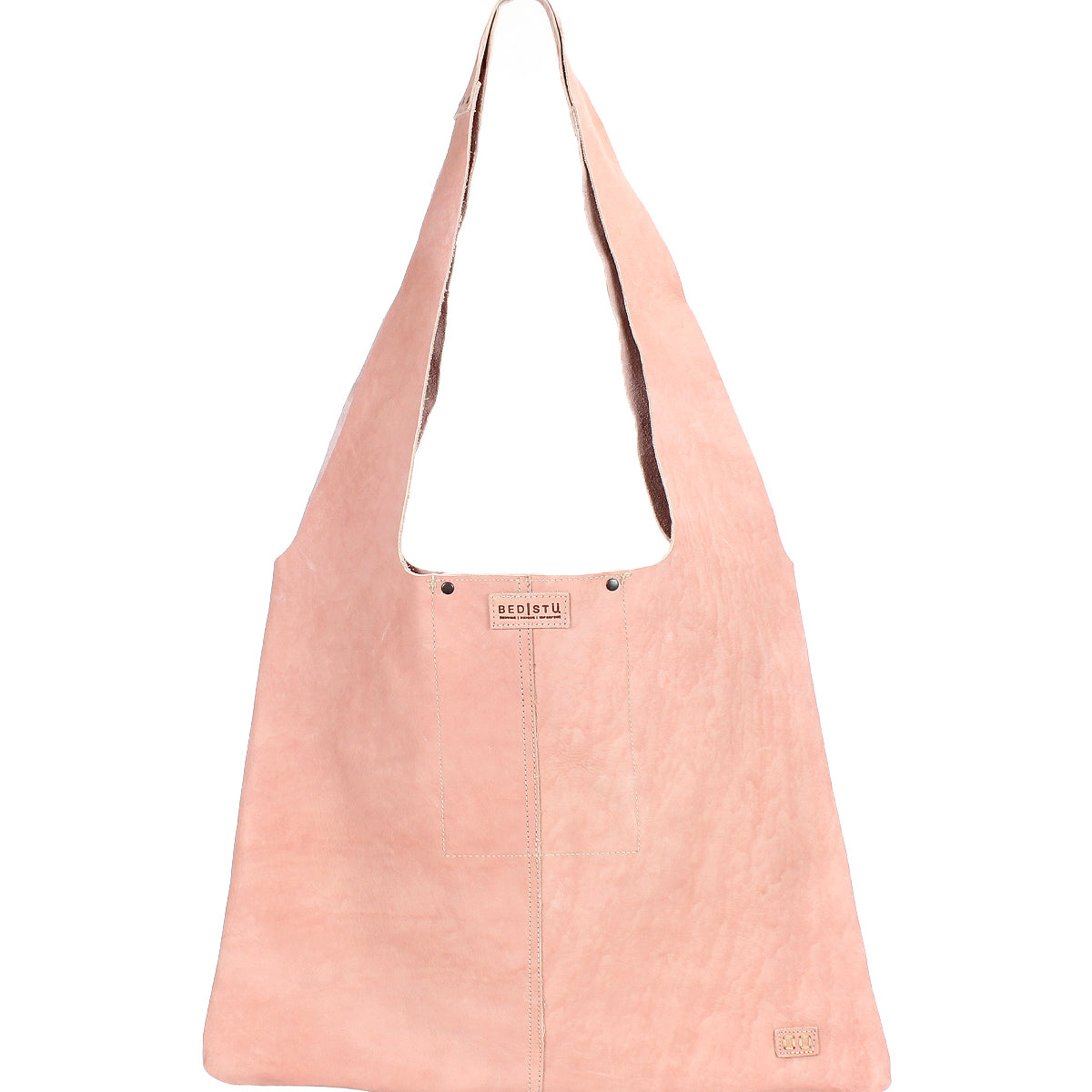 The Ariel II by Bed|Stü is a light pink suede spacious tote bag featuring a wide strap, visible center stitching, and a small rectangular Bed|Stü brand tag near the bottom right corner.
