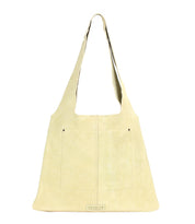 Beige leather Ariel II tote by Bed|Stü, featuring a single shoulder strap, two front pockets, and a small rectangular label at the bottom center—this spacious bag is perfect for carrying all your daily essentials in style.