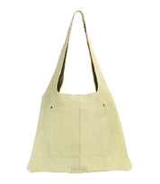 Introducing the Bed|Stü Ariel II, a beige leather tote shoulder bag featuring a single wide strap, spacious front patch pockets, and a rectangular logo patch at the bottom center. Combining functionality with timeless style, the Ariel II is perfect for everyday use.