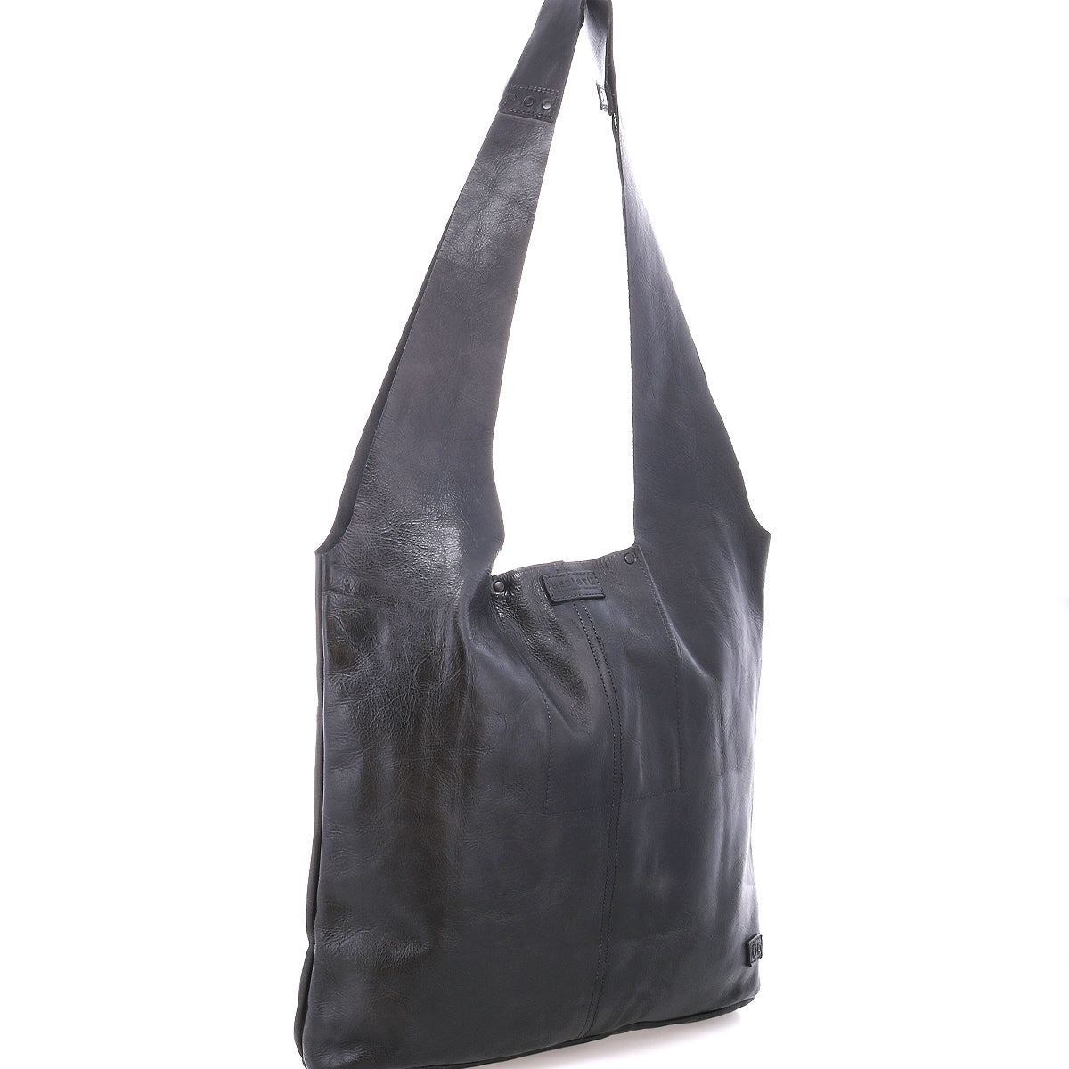 The Ariel Max by Bed|Stü is an oversized black leather shoulder bag with a rectangular silhouette and a long, wide strap. Hand-finished for a unique look, this spacious tote is perfect for carrying all your essentials in style and is photographed against a white background.