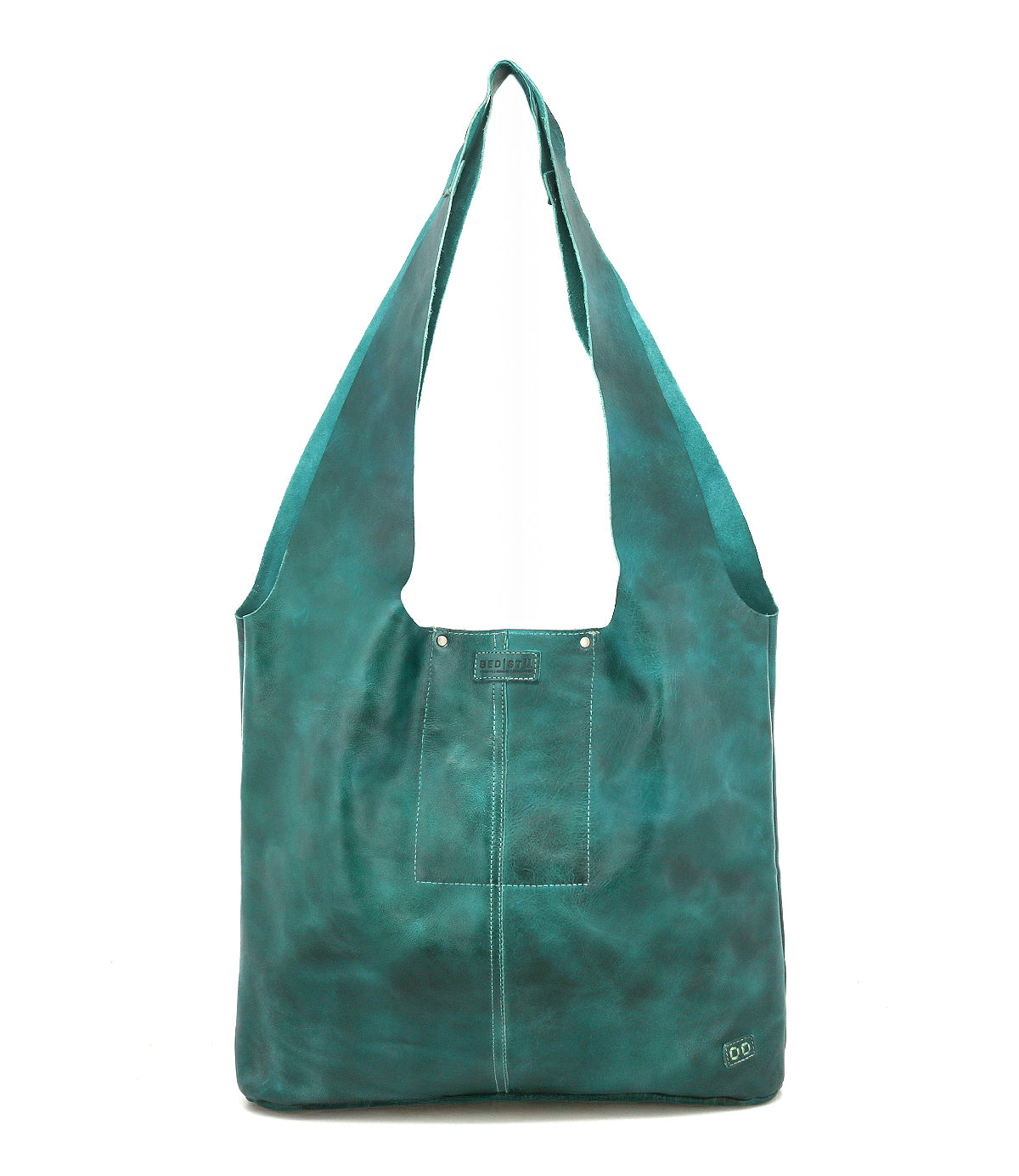 The Ariel Max by Bed|Stü is a teal hand-finished leather shoulder bag with wide straps, a square front pocket, decorative stitching, and a small metal logo in the lower right corner. This oversized tote offers a spacious interior and is shown against a plain white background.