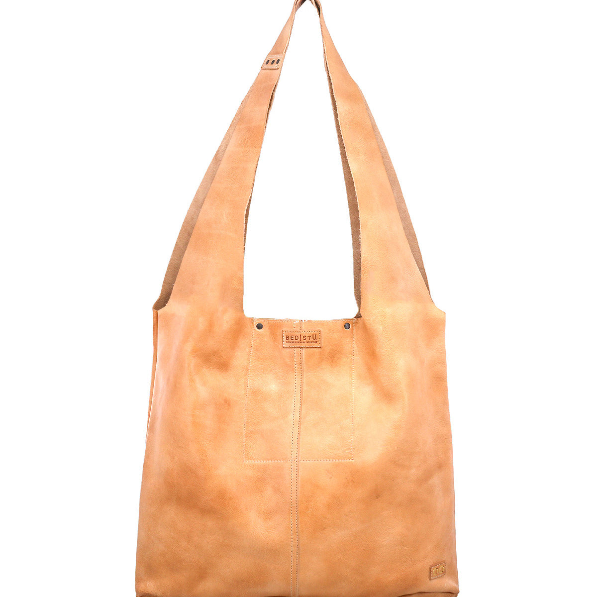 The Bed|Stü Ariel Max is a light brown hand-finished leather shoulder bag featuring wide straps, a rectangular silhouette, visible stitching, and a spacious interior, displayed against a white background.