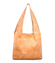 The Bed|Stü Ariel Max is a light brown hand-finished leather shoulder bag featuring wide straps, a rectangular silhouette, visible stitching, and a spacious interior, displayed against a white background.