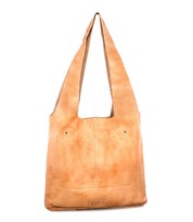 Introducing the Ariel Max by Bed|Stü—a tan leather shoulder bag featuring a wide strap, front pocket, and visible stitching on the front, expertly crafted from hand-finished leather and designed with a spacious interior to hold all your essentials.