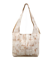 The Ariel Mid by Bed|Stü is an artisanal shoulder bag featuring a beige and brown tie-dye effect, two front pockets, a wide strap, and a rectangular base, displayed against a white background.