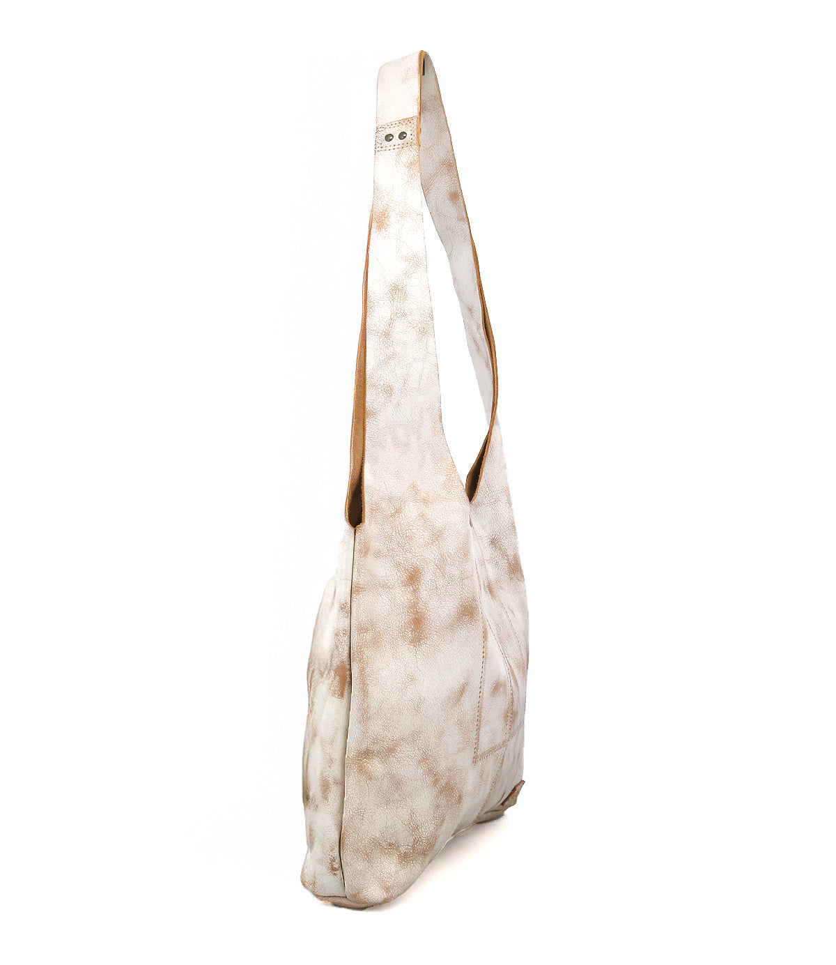 The Ariel Mid by Bed|Stü is an artisanal shoulder bag featuring a white and light brown tie-dye pattern, a long single strap, and is displayed standing upright at a side angle against a plain white background.