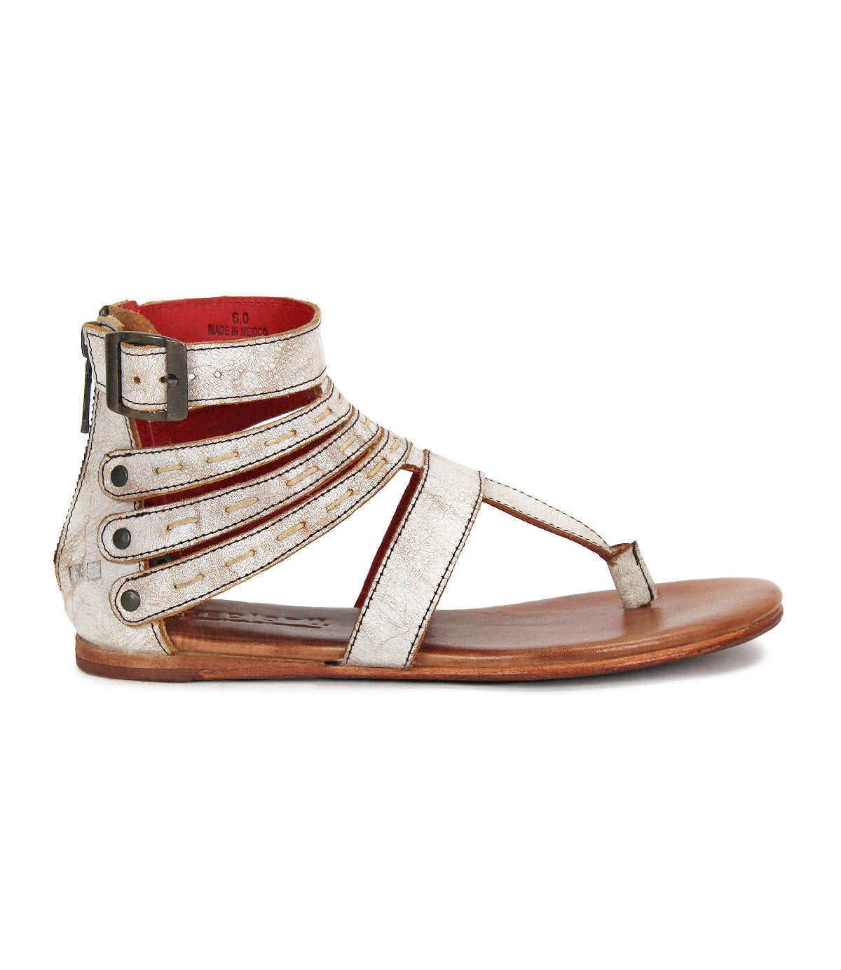 The Artemis II by Bed|Stü is a metallic silver gladiator sandal with multiple leather straps, a buckle closure, toe loop, and a flat brown sole, displayed in side profile.