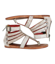 A pair of white Artemis II gladiator sandals by Bed|Stü, featuring leather straps with buckles and flat soles, displayed in a side profile view with the sandals placed facing each other.