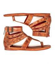 A pair of Bed|Stü Artemis II brown leather gladiator sandals, featuring leather straps, buckles, and zipper closures, displayed side by side to showcase the outer sides and side straps.