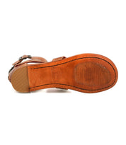 The underside of the Artemis II sandal by Bed|Stü, featuring brown leather straps and a textured rubber sole with a visible tread pattern, shown from a bottom view.