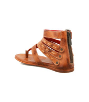 The Artemis II by Bed|Stü is a brown leather gladiator sandal featuring multiple leather straps, a back zipper, and an open toe, displayed against a white background.
