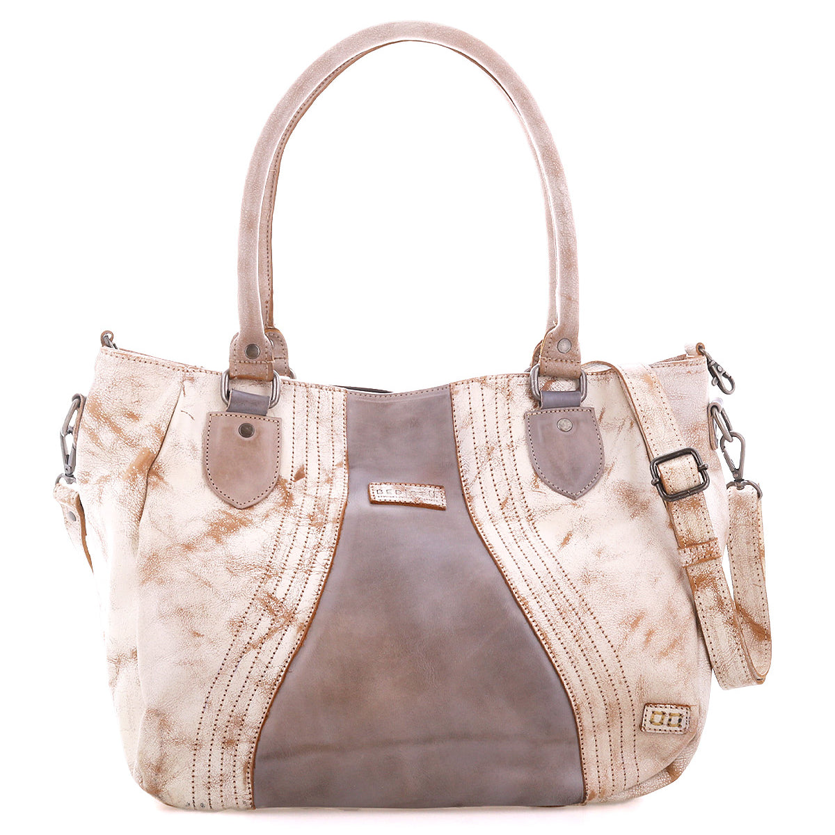 The Bed|Stü Astana is a large tan and brown leather handbag with dual handles, decorative stitching, metal accents, and a detachable shoulder strap, shown against a white background. This modern accessory blends timeless style with practical features, making it the ideal everyday bag.