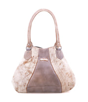 The Bed|Stü Astana is a modern tan and brown suede handbag featuring two handles, stitched detailing, and a small metal logo plate on the bottom right corner, shown against a white background.