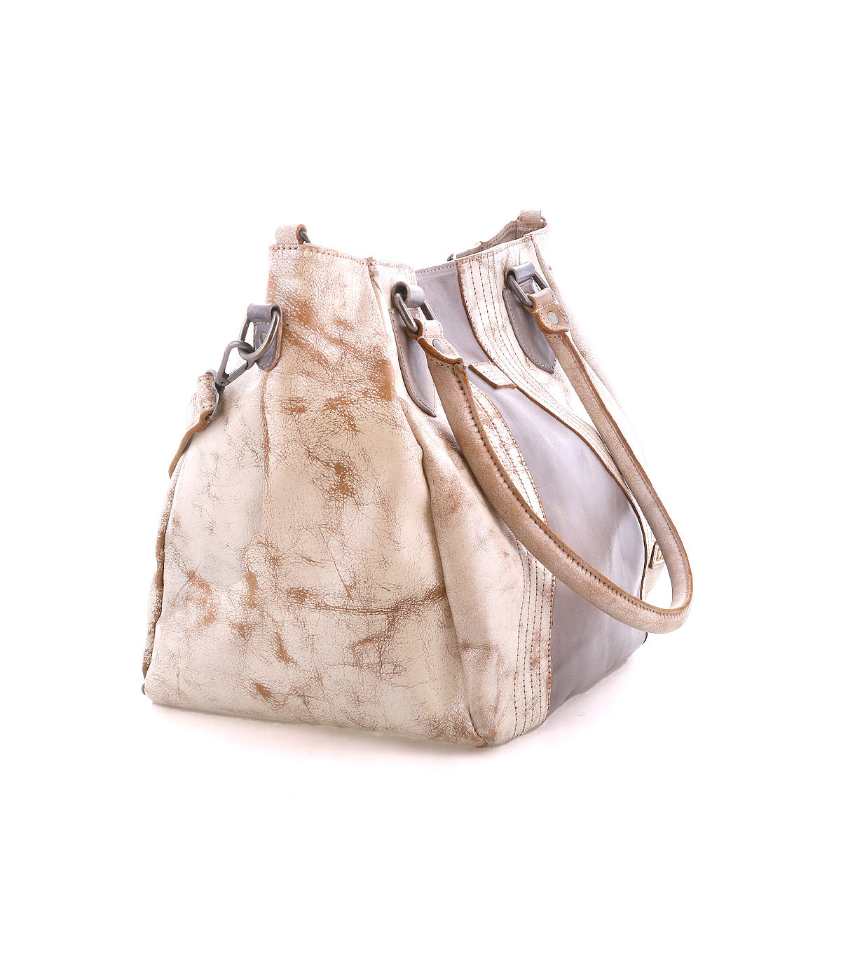 The Bed|Stü Astana is a modern handbag crafted from light beige and brown leather, featuring dual handles and a gently worn, textured finish that evokes the look of a vintage bowling bag, displayed against a plain white background.