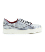 The Bed|Stü Azeli is a single gray, distressed-style leather sneaker featuring a white, durable rubber outsole, detailed side stitching, and two X-shaped stitches near the heel—crafted for all-day comfort.