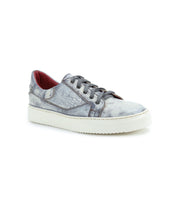 The Bed|Stü Azeli is a single gray low-top leather sneaker with a distressed finish, designed for all-day comfort. It features a durable rubber outsole, gray laces, and a striking red inner lining, shown here against a white background.