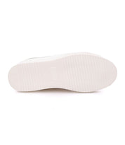 The image displays the bottom view of the Azeli by Bed|Stü, featuring a white rubber outsole with horizontal grooves and a central rectangular indent, emphasizing its durability and all-day comfort.